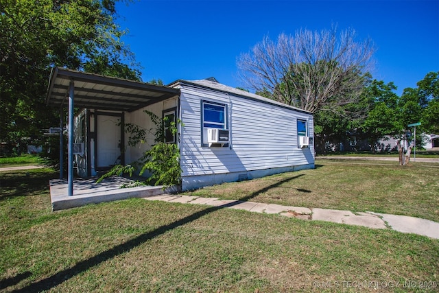 view of property exterior with cooling unit and a lawn