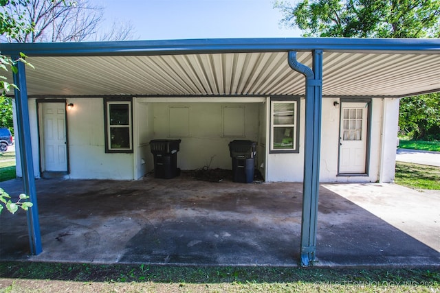 garage featuring a carport