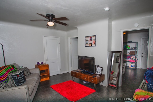 living room with a ceiling fan