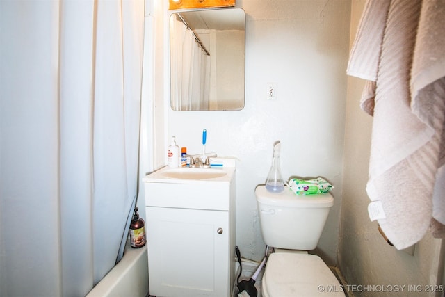 bathroom with toilet and vanity