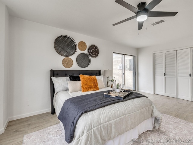 bedroom featuring light wood-style flooring, a closet, visible vents, and baseboards