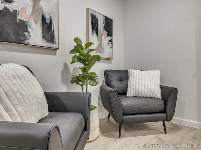 sitting room featuring light wood-style floors and baseboards