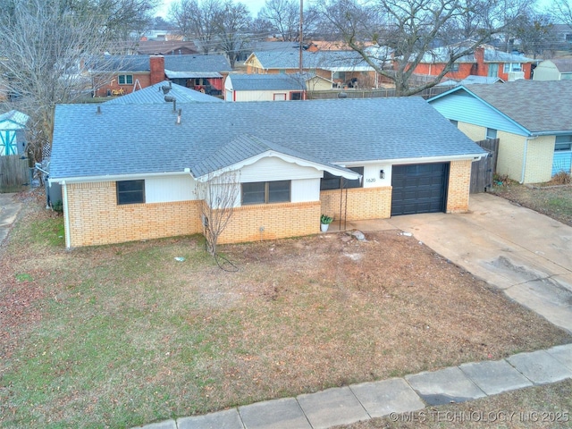 single story home with brick siding, a shingled roof, a garage, a residential view, and driveway