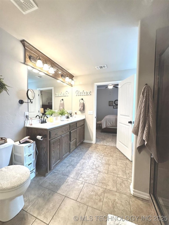 bathroom featuring ensuite bathroom, toilet, vanity, and visible vents