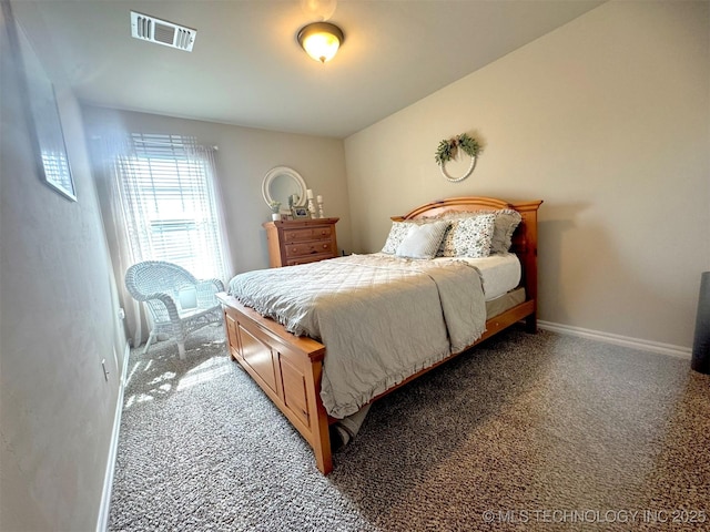 carpeted bedroom with baseboards and visible vents