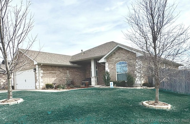 ranch-style home with an attached garage, brick siding, a front yard, and a shingled roof