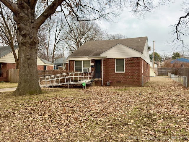 back of property with fence private yard, crawl space, brick siding, and cooling unit