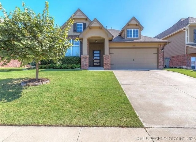 view of front of home with a garage, driveway, brick siding, and a front yard