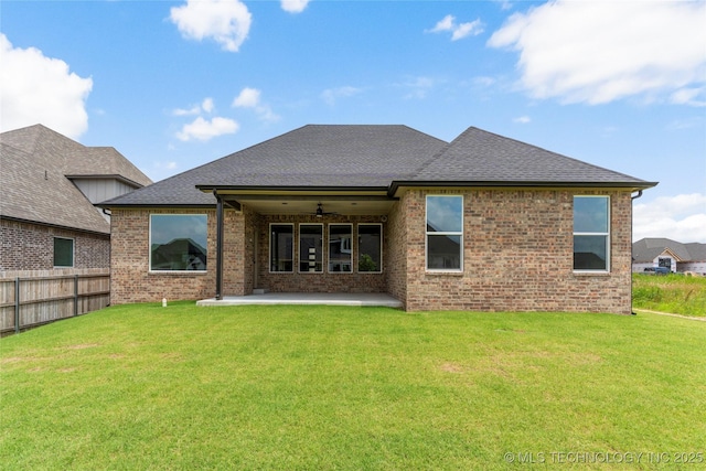 13630 S 21st Pl E, Bixby, OK 74008 - back of property with ceiling fan, a patio area, brick siding, and roof with shingles