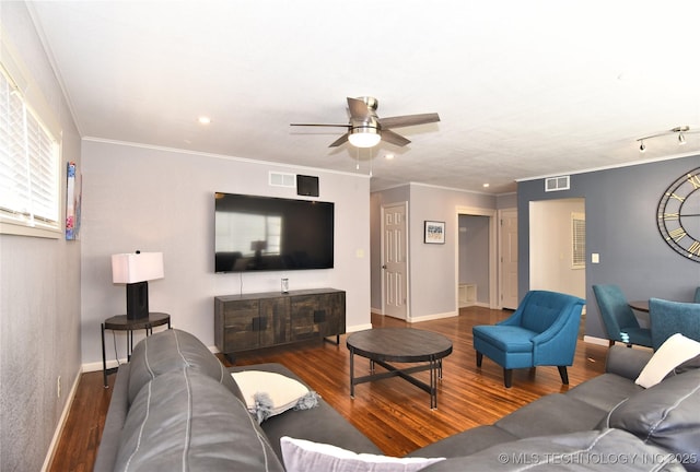 living room with ornamental molding, dark wood-style flooring, and visible vents