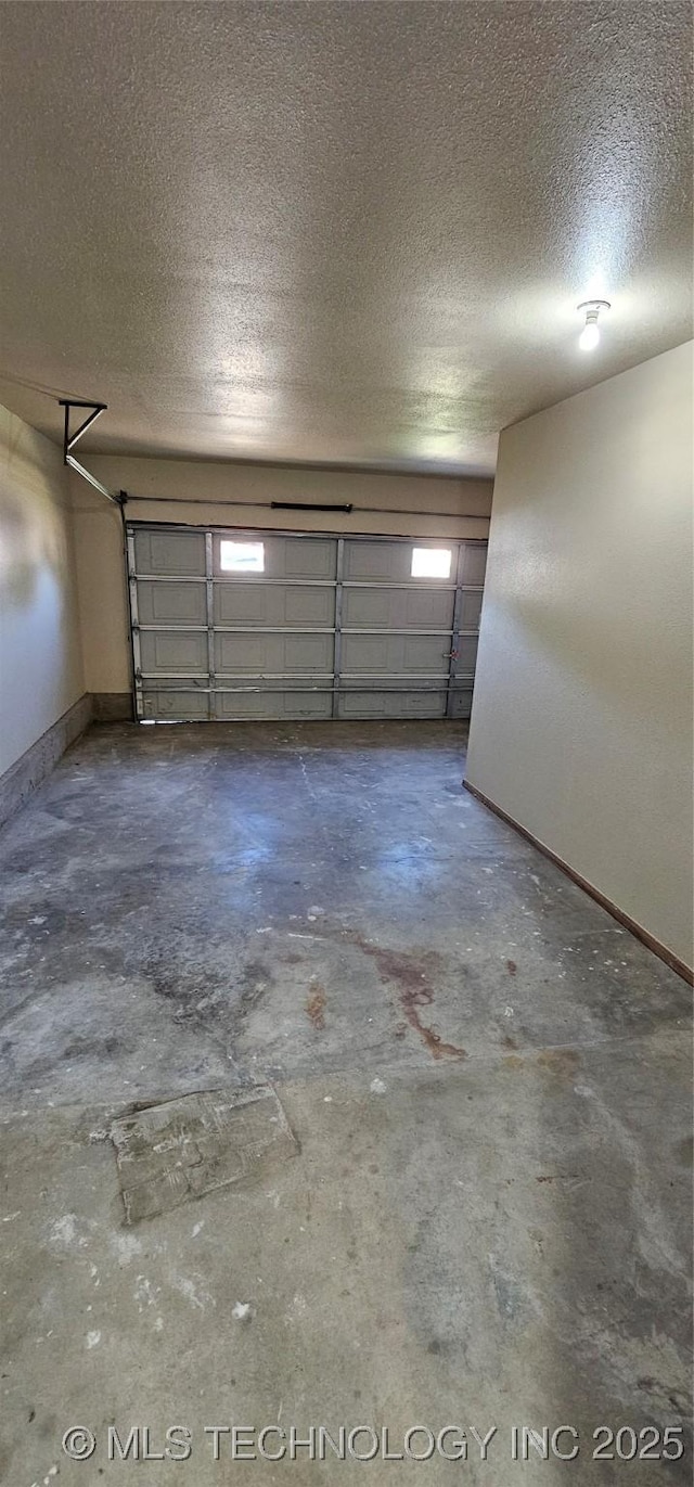 garage featuring baseboards