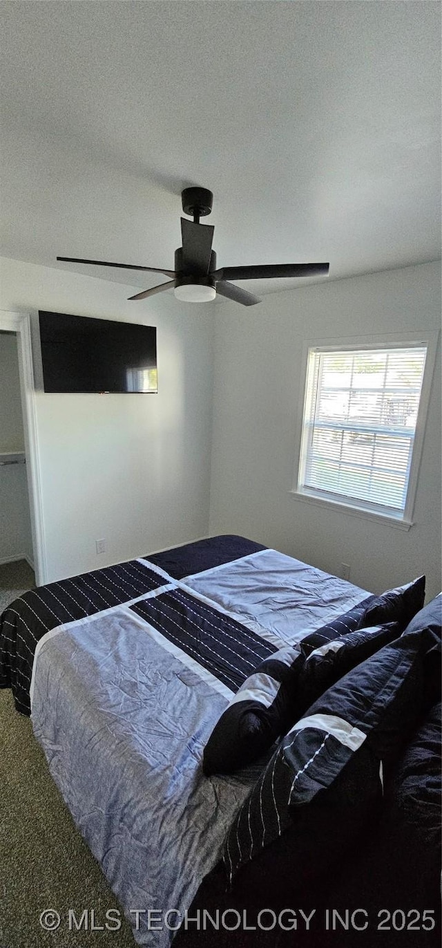 bedroom featuring carpet flooring and a ceiling fan