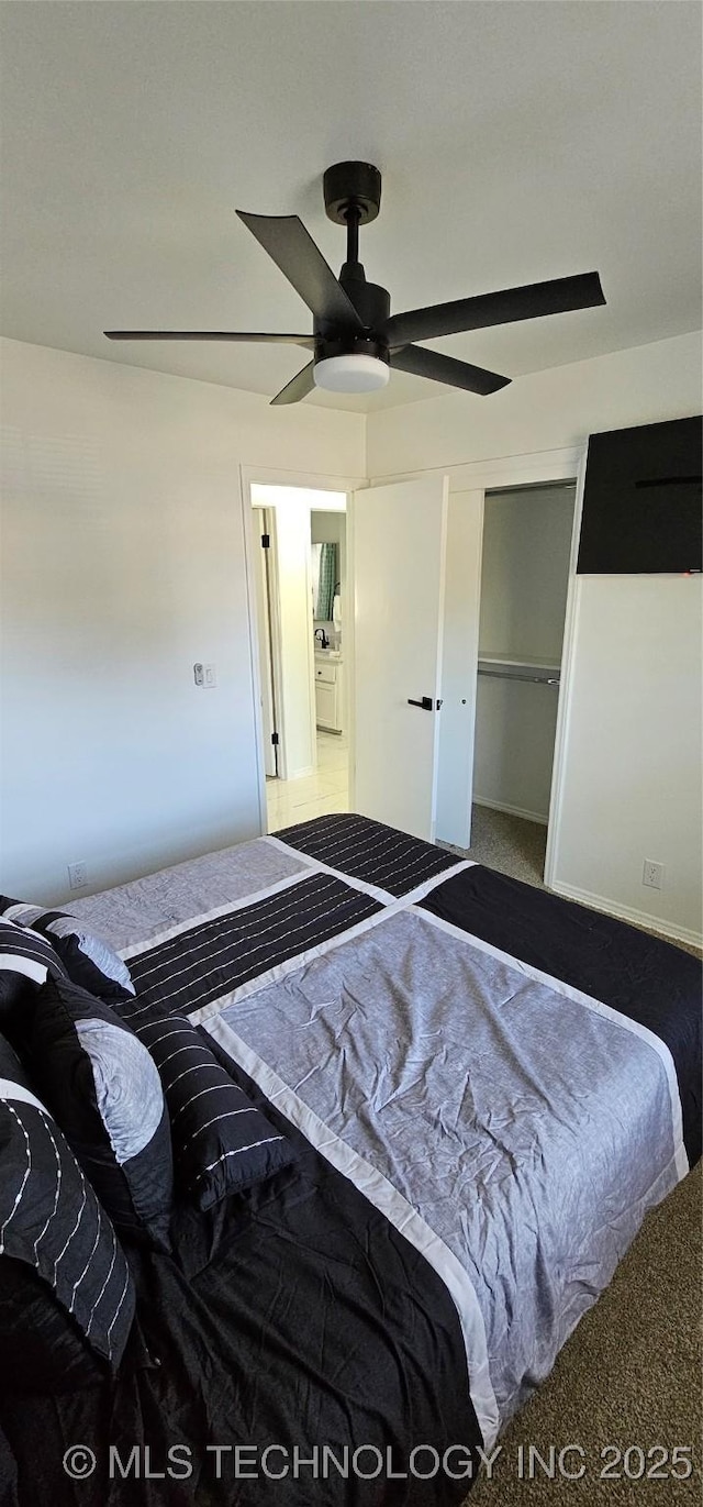 bedroom featuring carpet floors, a ceiling fan, and a closet