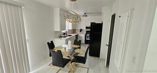 dining area featuring marble finish floor and baseboards