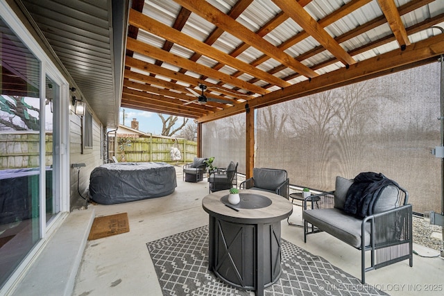 view of patio / terrace with fence, an outdoor living space, and a ceiling fan