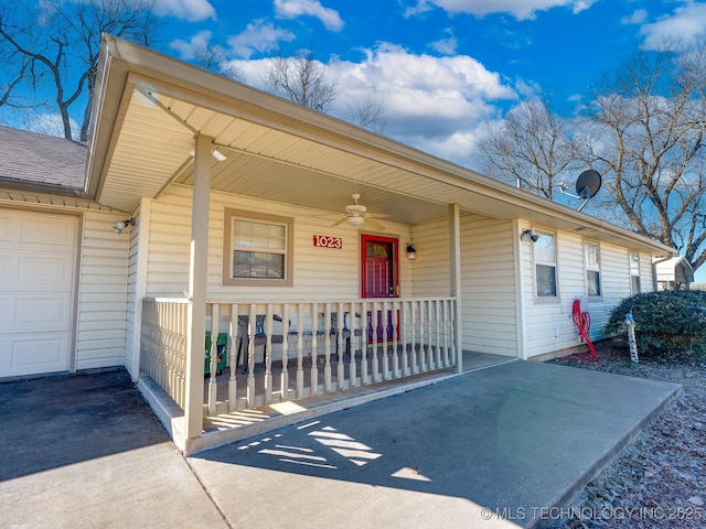 exterior space with a garage, driveway, and a porch