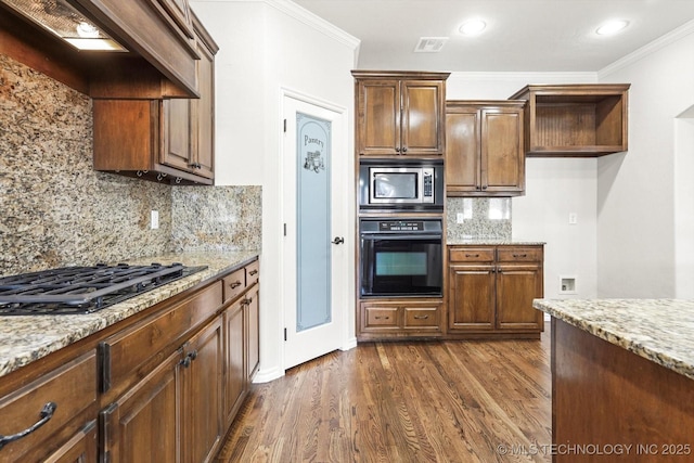 kitchen featuring light stone countertops, black appliances, dark wood-style floors, and custom exhaust hood