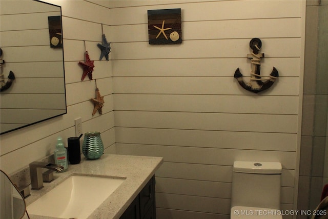 bathroom with toilet and vanity