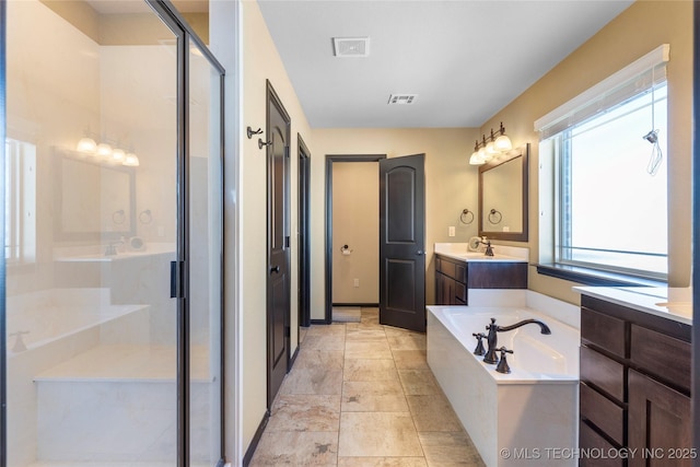 full bath featuring visible vents, vanity, a shower stall, and a bath