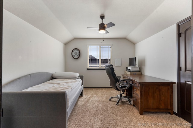 office area with lofted ceiling, light carpet, a ceiling fan, and baseboards