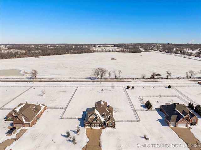 snowy aerial view with a rural view