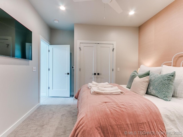 carpeted bedroom with a closet, recessed lighting, a ceiling fan, and baseboards