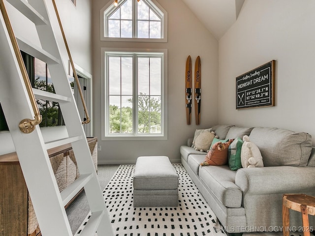 interior space with baseboards and vaulted ceiling