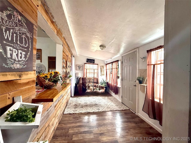 foyer featuring a textured ceiling and wood finished floors