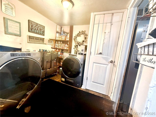 laundry room with laundry area and washer and clothes dryer