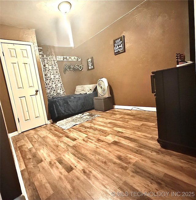 unfurnished bedroom with wood finished floors