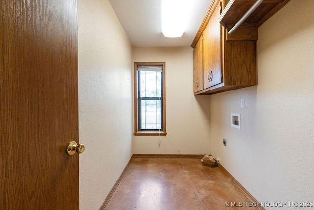 laundry room with hookup for a washing machine, cabinet space, baseboards, and electric dryer hookup