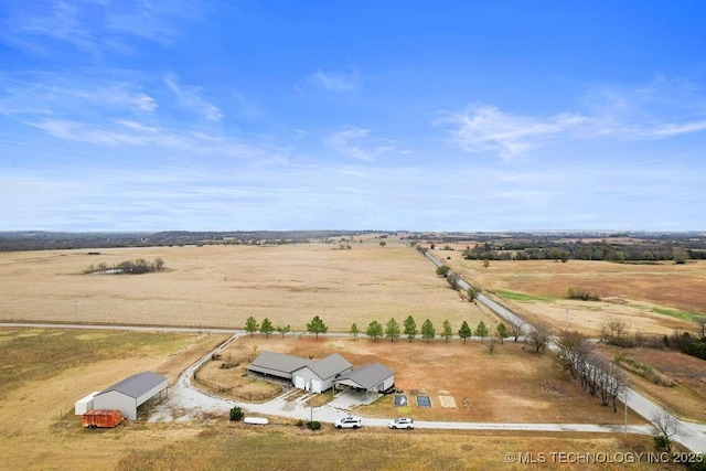 birds eye view of property with a rural view