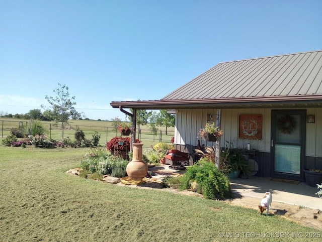 view of yard featuring fence and a rural view