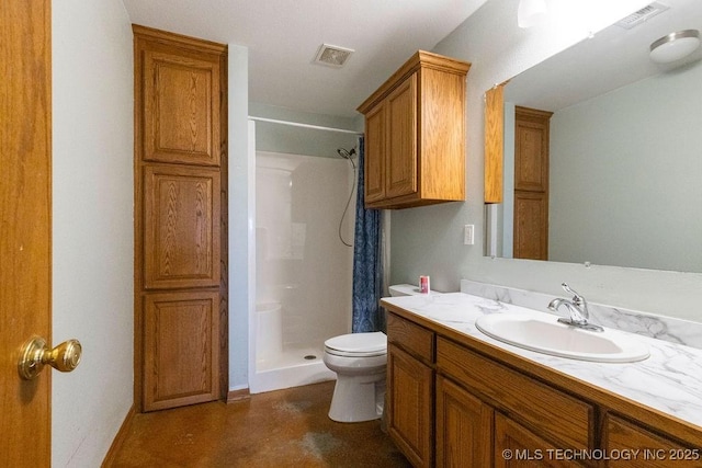 bathroom featuring toilet, a stall shower, vanity, and visible vents