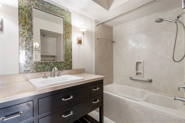 bathroom featuring bathing tub / shower combination and vanity