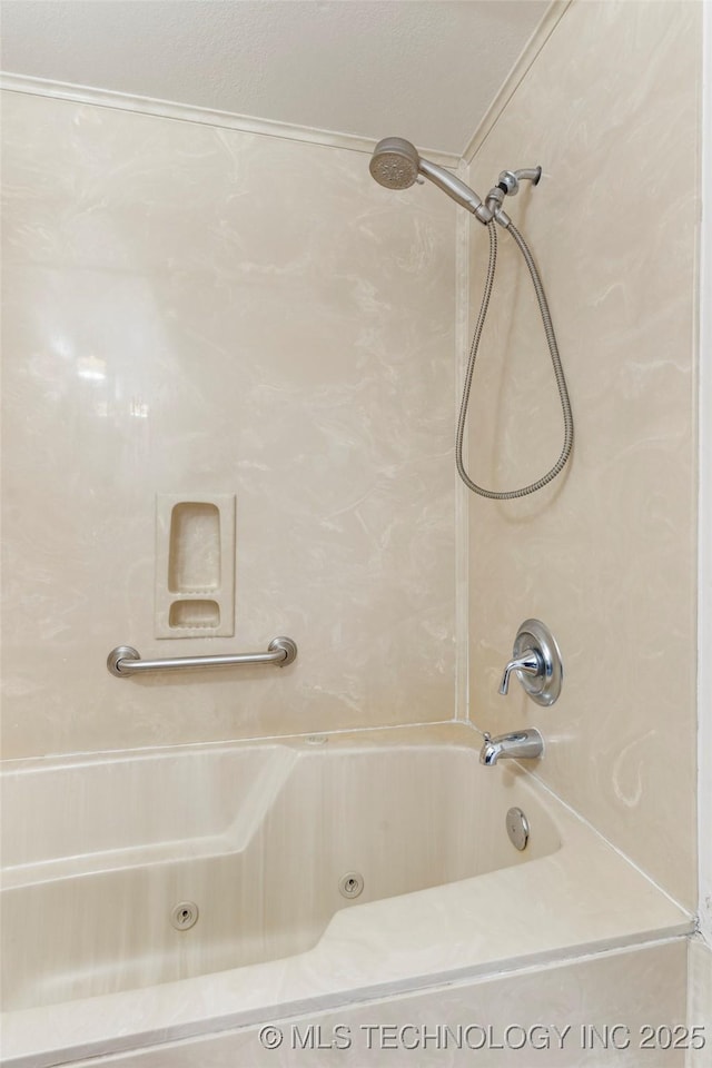 bathroom with a combined bath / shower with jetted tub