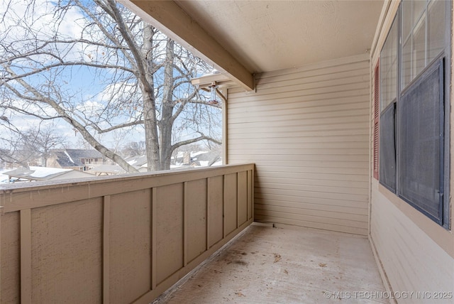 view of snow covered back of property