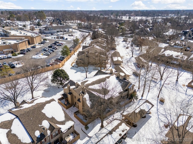 snowy aerial view with a residential view