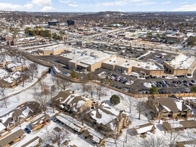 snowy aerial view with a residential view