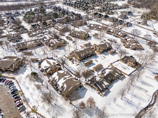 snowy aerial view featuring a residential view