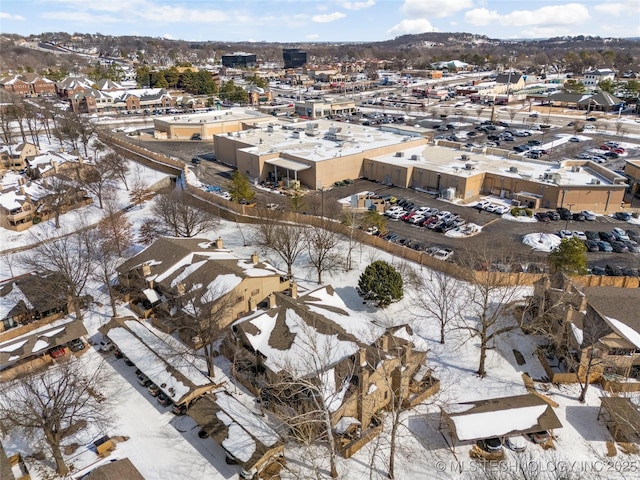 snowy aerial view with a residential view