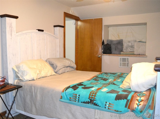 bedroom with vaulted ceiling and visible vents