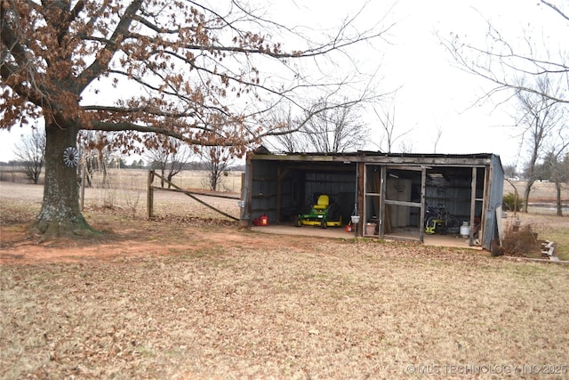 view of pole building featuring a rural view