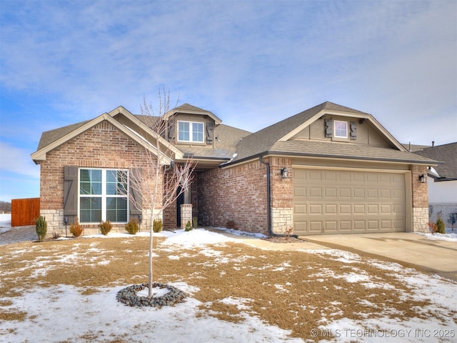 view of front of home featuring a garage, brick siding, driveway, stone siding, and roof with shingles