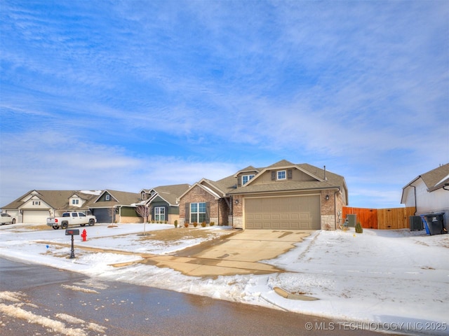 view of front facade featuring an attached garage, a residential view, concrete driveway, and brick siding