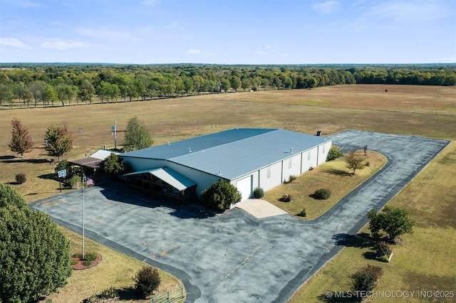 bird's eye view featuring a rural view and a wooded view