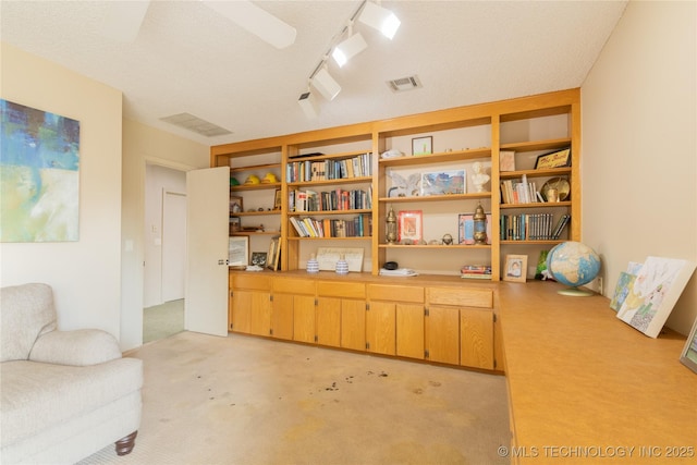 sitting room with light carpet and visible vents