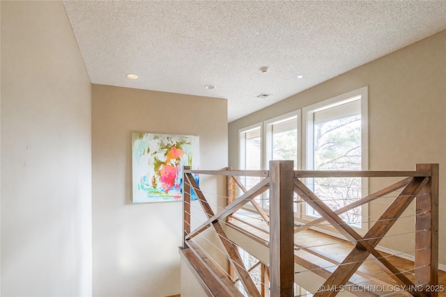 interior space with visible vents and a textured ceiling