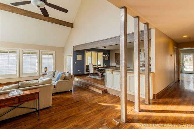 living room featuring high vaulted ceiling, dark wood finished floors, a ceiling fan, and baseboards