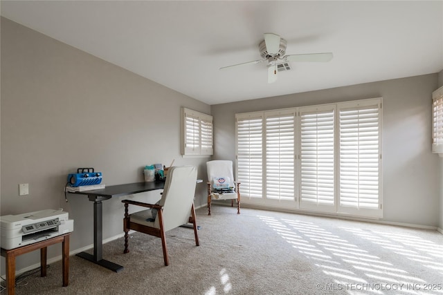 office featuring carpet, ceiling fan, and baseboards